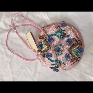 Pink bejeweled and beaded handbag